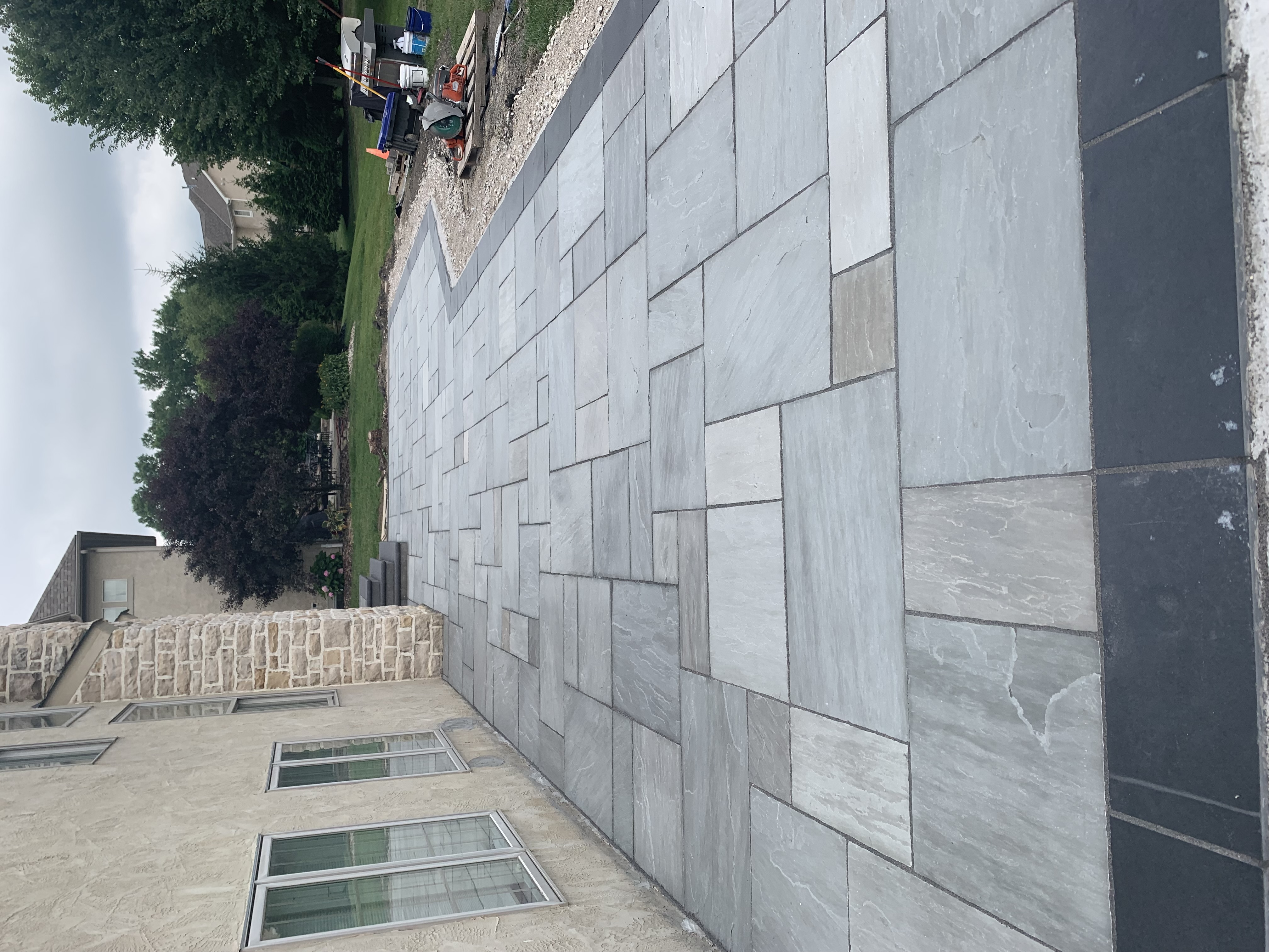 Large bluestone patio with dark border