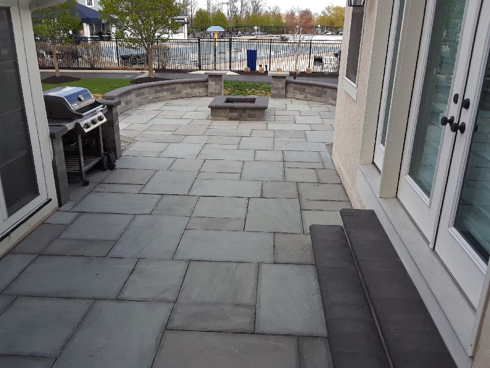 Bluestone patio with fire pit and seating wall