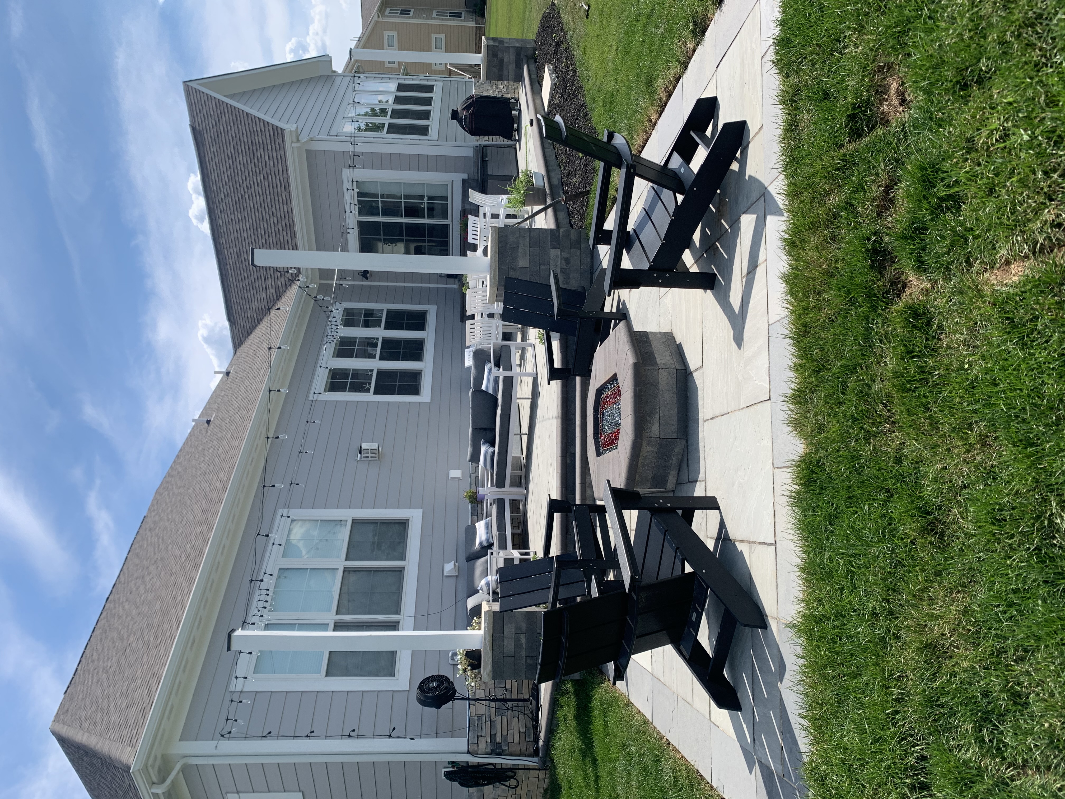 Patio with fire pit and Adirondack chairs